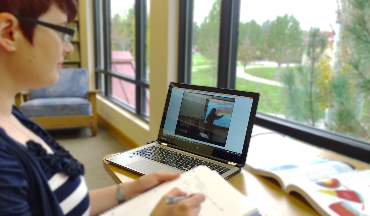 Online Student inside with laptop